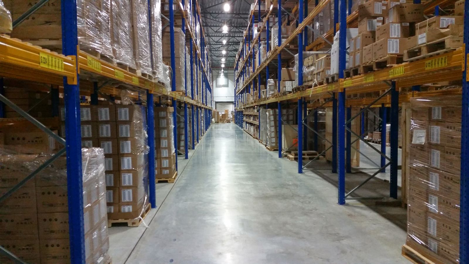 Palletised FMCG stock arranged for rotation in a warehouse